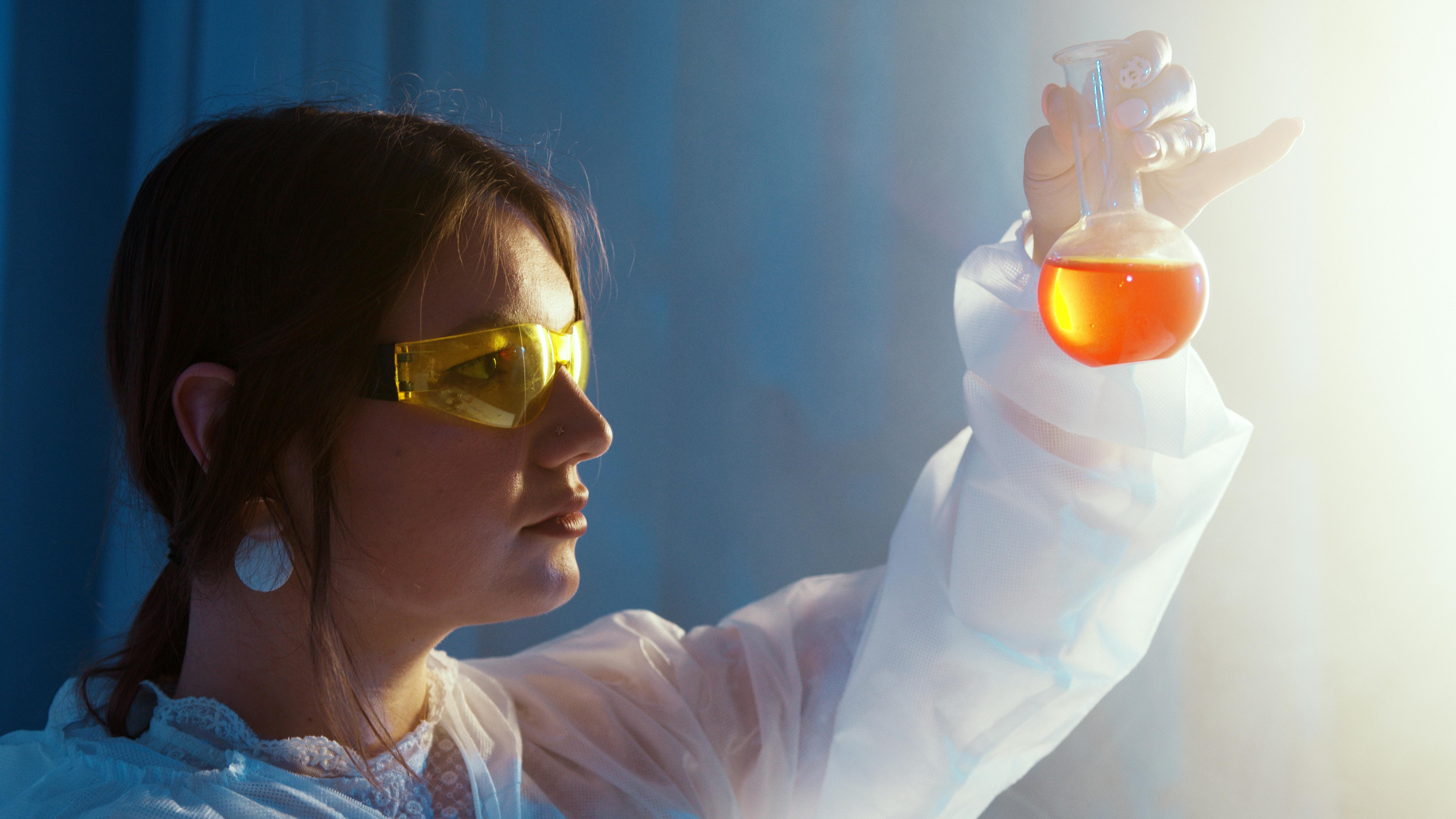 Chemist Looking at Sample